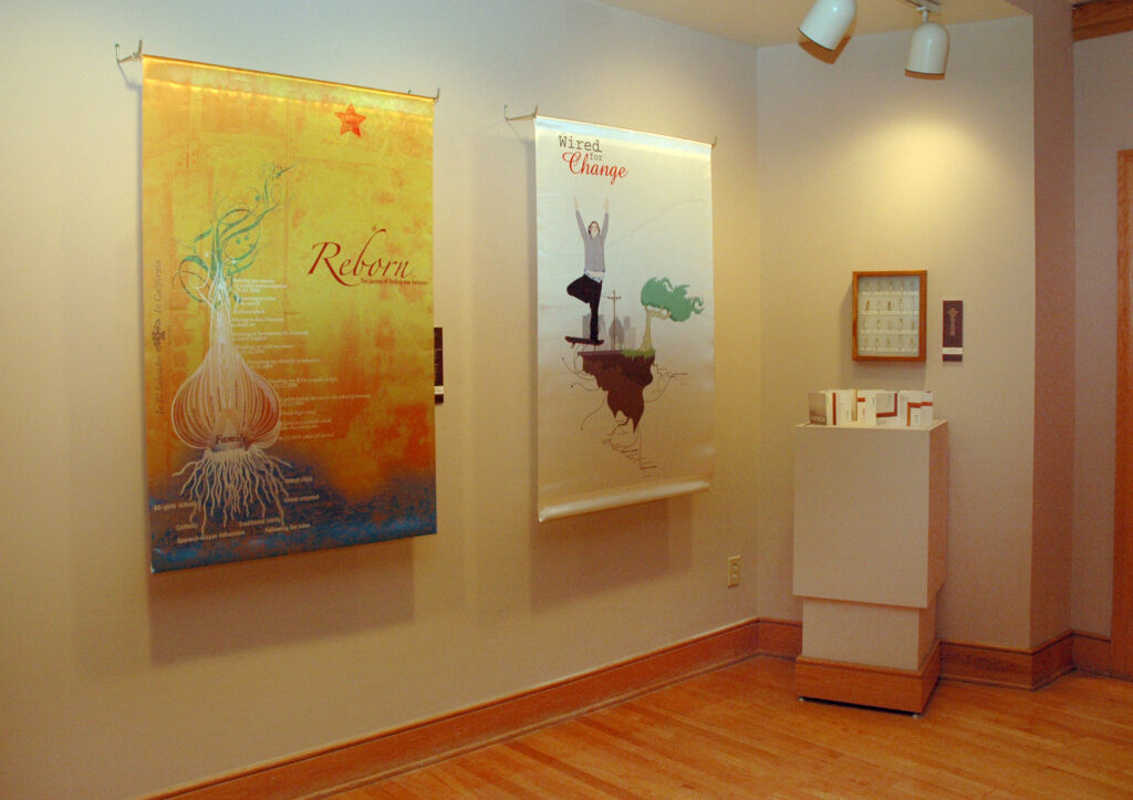 The corner of the exhibit with posters and a small installation