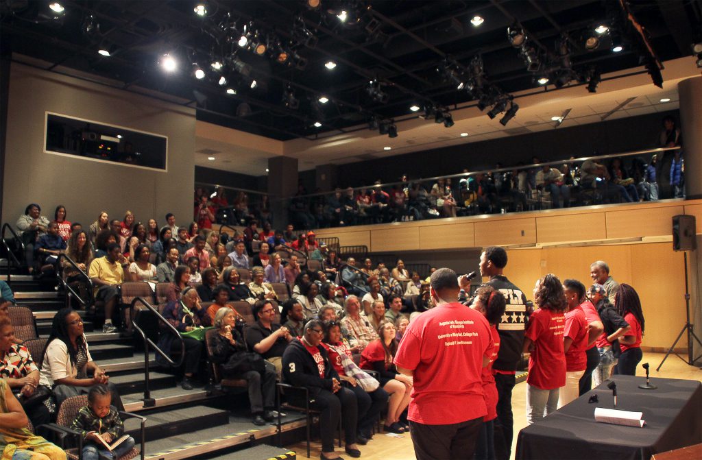 Students performing an auditorium.